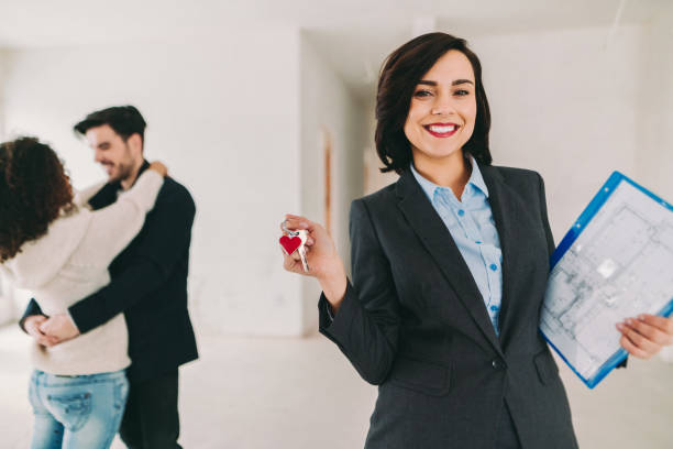 istock Real estate agent showing new home to clients 1401350861