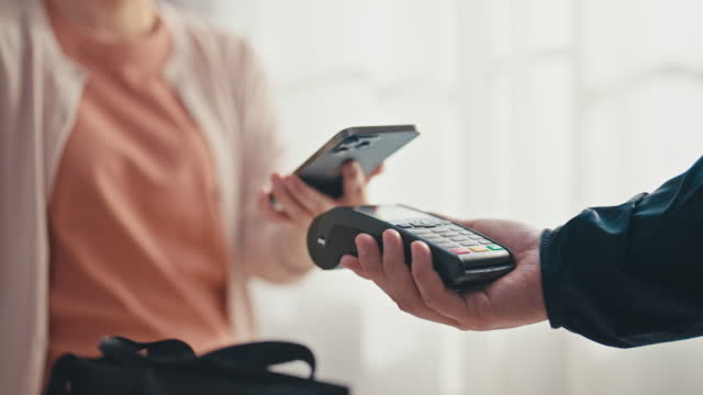 Using NFC technology to pay with mobile phone at Store