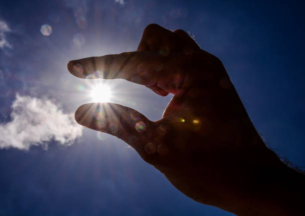 istock Hand over the Sky and Sun 1401352070