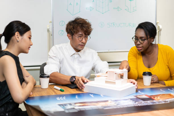 Free Stock Photo of Architect designer explaining house model to client ...
