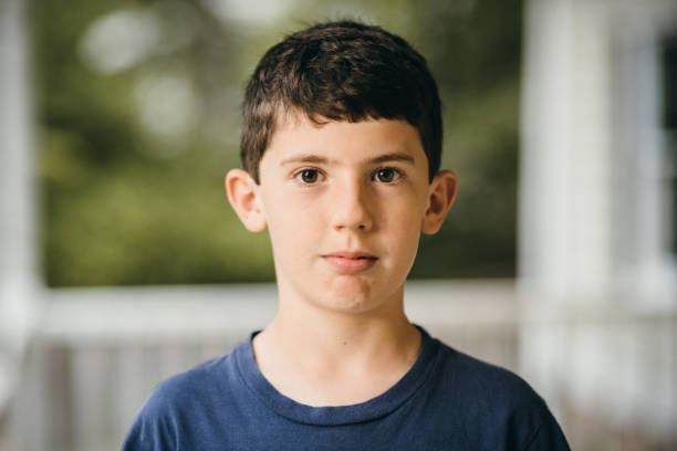 istock 12 year old boy portrait 1401358775