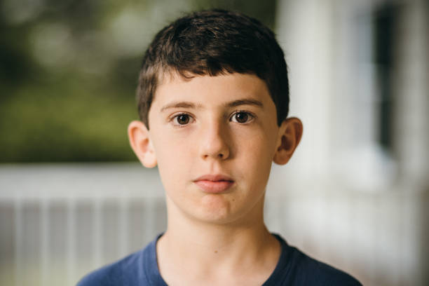 istock 12 year old boy portrait 1401358776