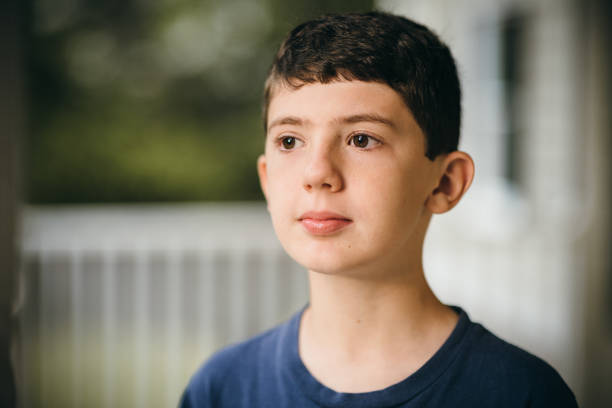 istock 12 year old boy portrait 1401358778