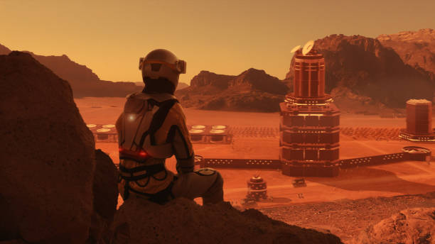 istock Astronaut on planet Mars watching a space station. Earth colony in Space 1401359417