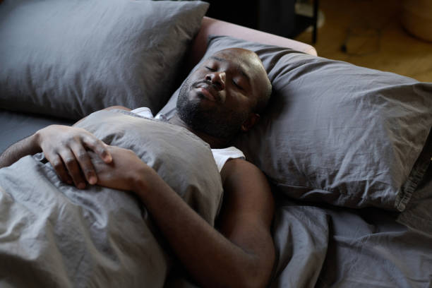 istock African man sleeping in his bed 1401361188