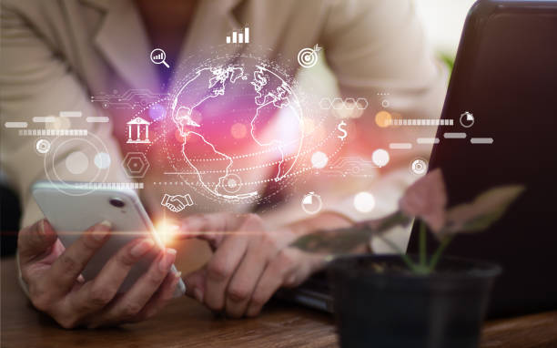 istock Woman utilizing mobile phone connect to worldwide network for data sharing, business development, metaverse. Digital marketing, Internet technology Financial, banking,investment,international business 1401361497