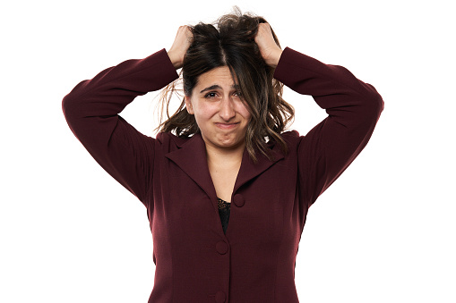 Very angry and frustrated indian businesswoman, closeup isolated on white background