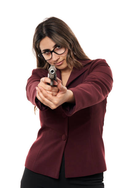 Indian businesswoman with a gun isolated on white background