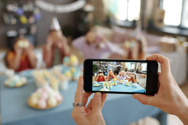 istock Children posing on camera of smartphone 1401364127