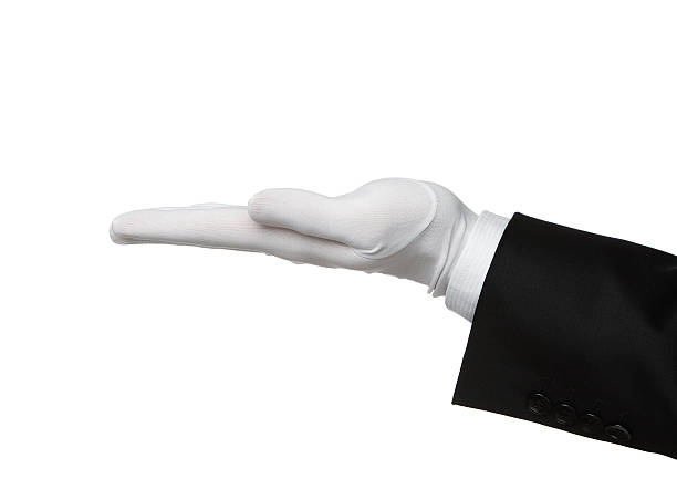 butler's hand mit einem produkt - glove stock-fotos und bilder