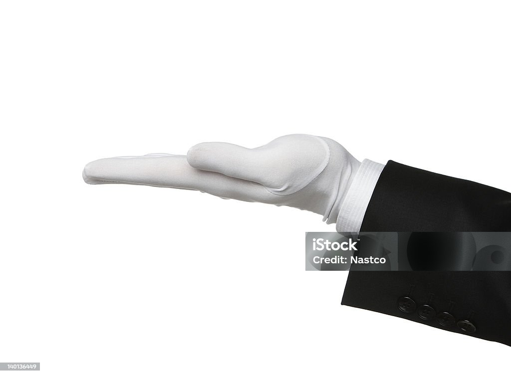 Butler's hand offering product Elegant human hand presenting product or waiting for a tip Glove Stock Photo
