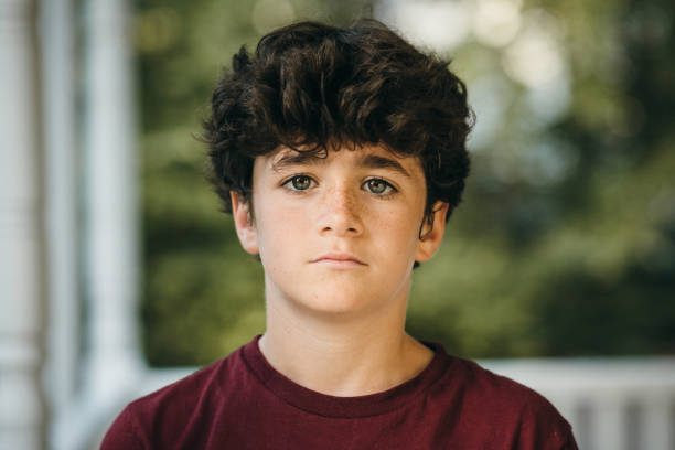 istock 13 year old boy portrait 1401364500