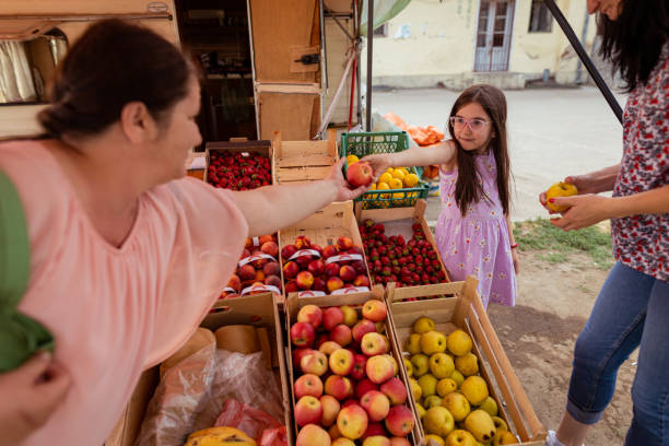 istock Little girl with a smile serving customer 1401364674