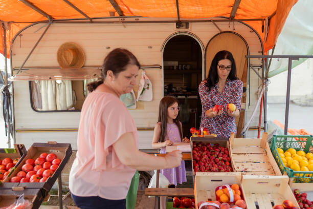 istock Young mother and daughter working on market 1401364773