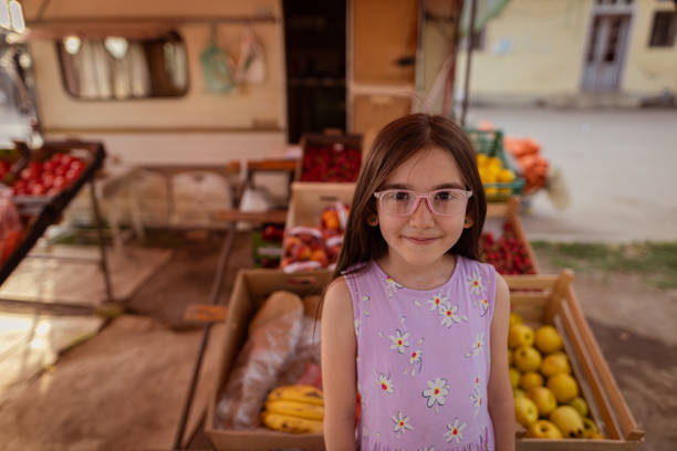 Girl holding a lot of lemons in her hands
