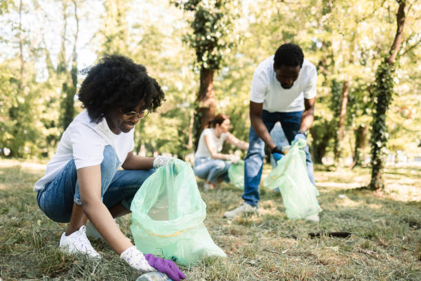 istock Group of young environmentalists collecting garbage at their park 1401367517