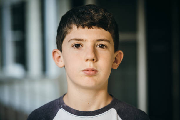 istock 12 year old boy portrait 1401374517