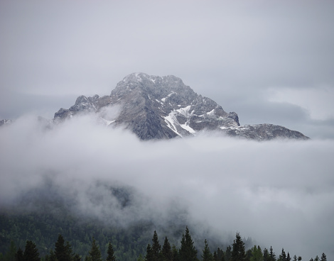 Close-up view of the top of the Kamnik Alps with the surrounding mist from Velika Planina, Slovenia