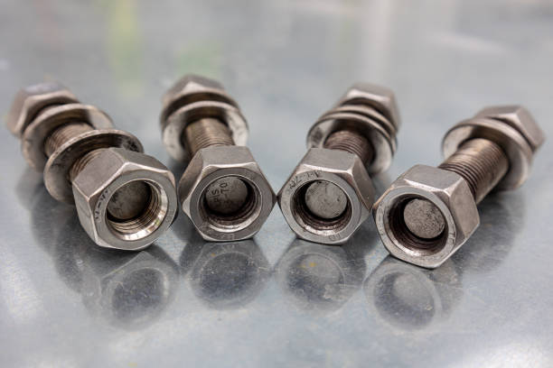 istock Large bolts and nuts on a galvanized sheet, 1401380319
