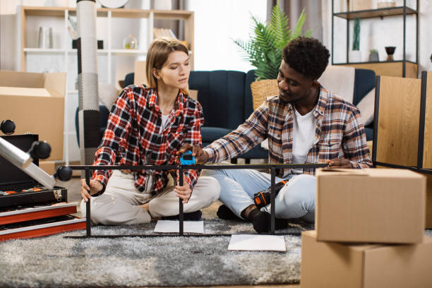 istock Multiracial couple assembling furniture at home 1401381412