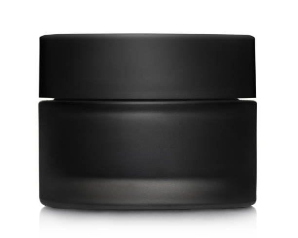 istock Black cosmetic cream jar on white 1401381443