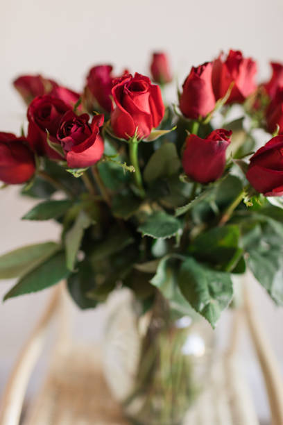 istock Two Dozen Classic Rich Red Roses in Bright Natural Light 1401381462