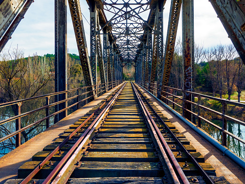 Image of Low view of train tracks on railroad bridge along Heart of Ohio Trail