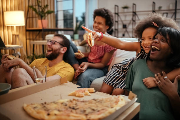 istock Family watching TV 1401384037