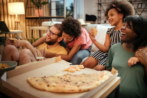 istock Family watching TV 1401384045