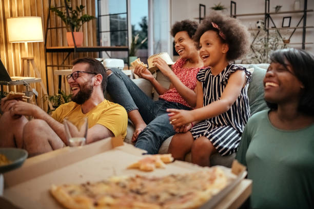 istock Family watching TV 1401384046
