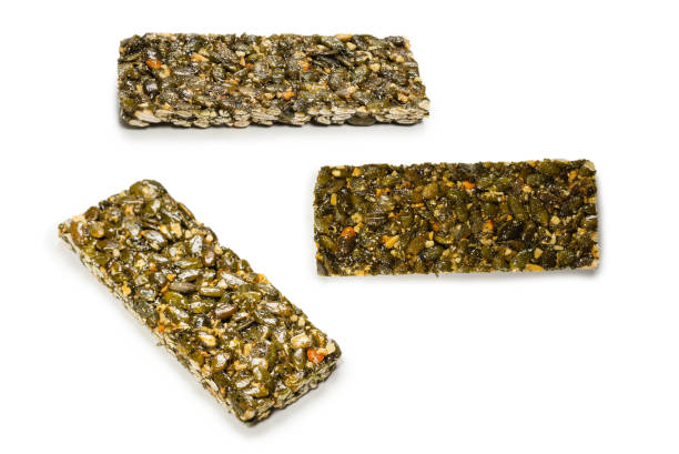 istock Bar with nuts isolated on a white background. Pumpkin seeds bar. 1401384325