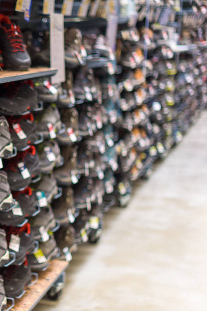 istock Out of focus vertical image with a shelf full of sample sneakers, selective focus. 1401384549
