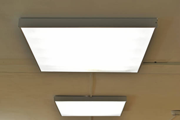 istock Square white lamp on the ceiling in the office 1401385292