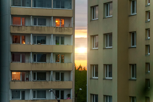 Sunset on between two old soviet buildings.