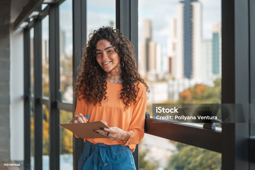 University student portrait Young Teenager, Document, Looking at Camera, Intern, Orange Trainee Stock Photo