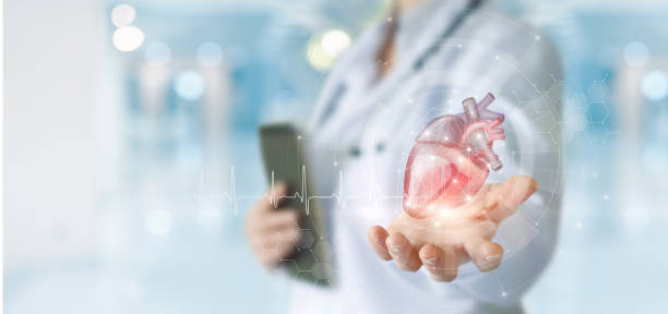istock Doctor shows a heart in front of a virtual computer . 1401390544