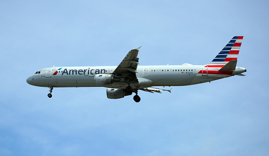 Chicago, IL, USA. American Airlines Airbus A321 plane prepares for landing at Chicago O'Hare International Airport.