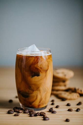 Iced latte on wooden table