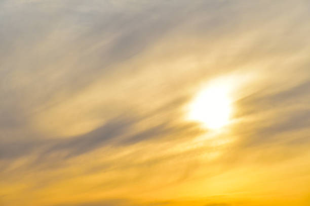Evening sunset sky with blue and yellow clouds