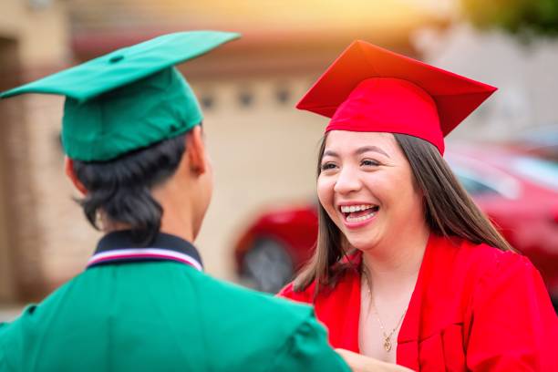 istock Hispanic couple at their graduation ceremony 1401397163