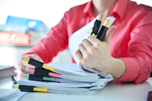 istock Businesswoman hands sorting business reports 1401398979