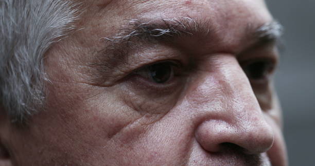 istock Dramatic pensive senior man, close-up older person eyes 1401399570