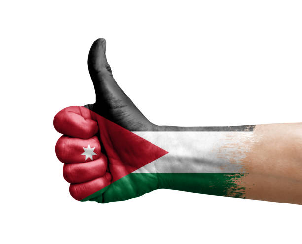 istock Hand making thumb up painted with flag of jordan 1401400335