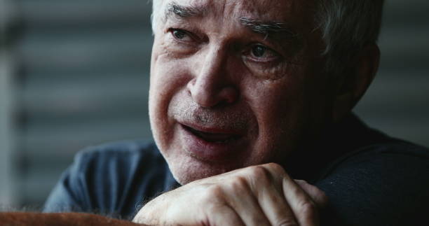 istock Desperate old man crying. Senior wiping tears in crisis 1401400700