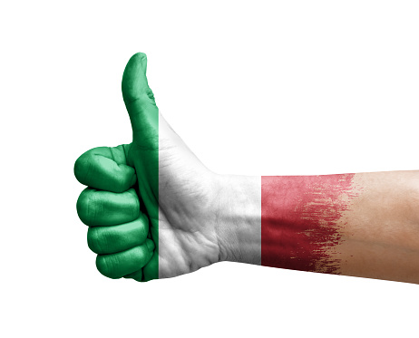 Hand making thumb up painted with flag of italy