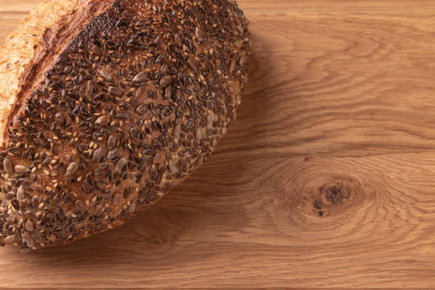 istock fresh homemade bread on wooden background, top view 1401402594