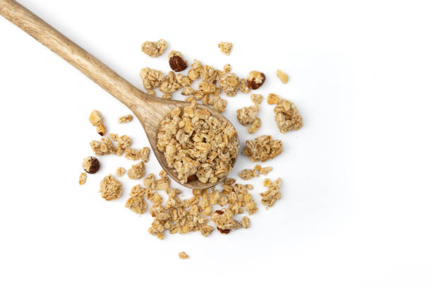 istock wooden spoon with musli isolated on white 1401402598