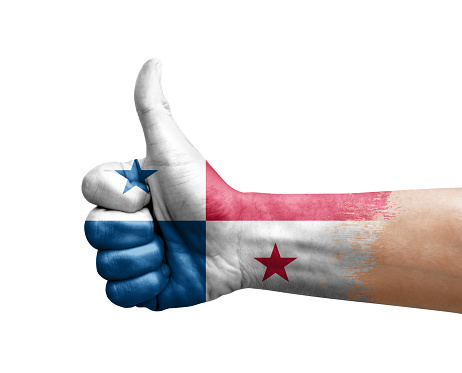 Hand making thumb up painted with flag of panama