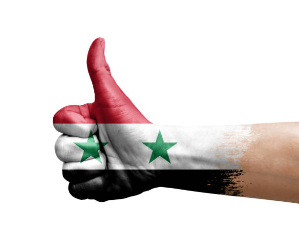 istock Hand making thumb up painted with flag of syria 1401404699