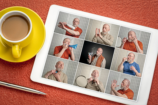 reviewing a set of studio portraits on a digital tablet featuring the same senior male model with a variety of props, grooming, health and self care theme